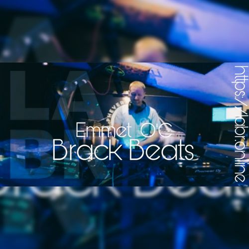 White British brother with short red hair. With a t-shirt on that looks light blue. But is probably the blue from the Phever Studio lights that he's standing in. The word Phever is written over his right (are left) shoulder. Full Pioneer set up. Moniter to the right site "his left" A screen behind him that's off. LABR transparent over the graphic. And over all of that in white, the words Emmet O'C. Right under that, his show name. Brack Beats. Also in white but vertical, is the website https://labr.online