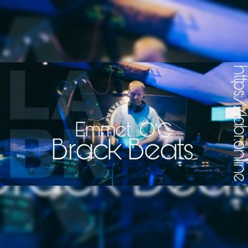 White British brother with short red hair. With a t-shirt on that looks light blue. But is probably the blue from the Phever Studio lights that he's standing in. The word Phever is written over his right (are left) shoulder. Full Pioneer set up. Moniter to the right site "his left" A screen behind him that's off. LABR transparent over the graphic. And over all of that in white, the words Emmet O'C. Right under that, his show name. Brack Beats. Also in white but vertical, is the website https://labr.online